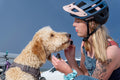 Girl giving her dog the pet tincture 
